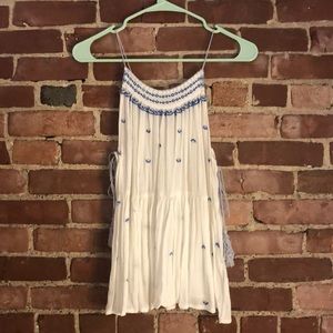 White summer blouse with blue embroidery